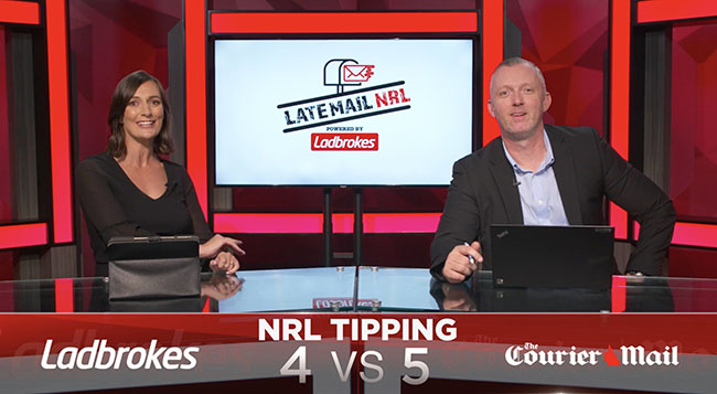 Photo of two hosts, a man and a woman sitting behind a desk presenting the late mail NRL tv show